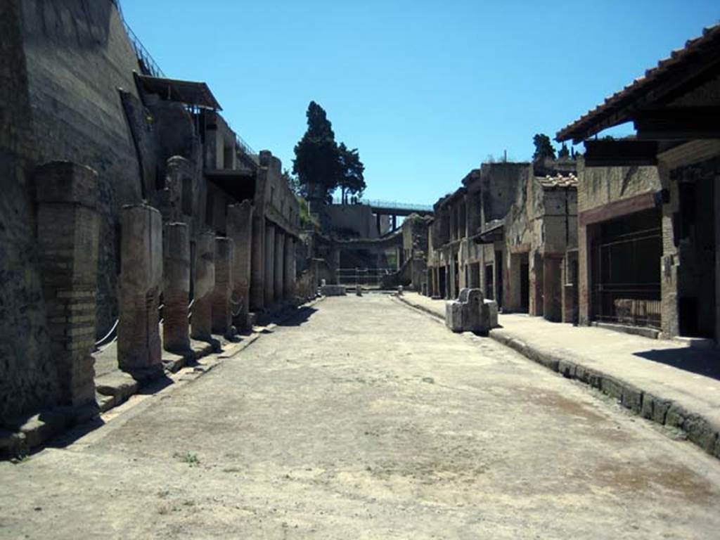 Decumanus Maximus, Herculaneum. June 2011. Looking east from four-sided Arch on Decumanus Maximus.
The entrance in the photo below can be seen here on the left, guarded by two ropes across it. Photo courtesy of Sera Baker.